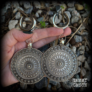 These big beautiful antique silver mandala gauged earrings are gorgeous!! Weighing in at approx 33grams a piece, measuring just on 12cms from tip to tip, this pair of gauged earrings are lovely and dangly but not too heavy.

This pair have been made on 1” gauge (25mm) surgical steel cradles, suitable for stretched lobes.
