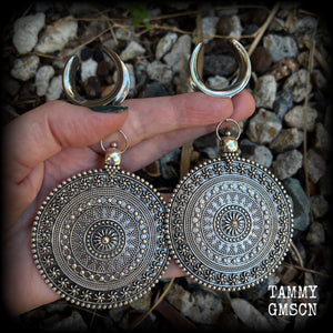 These big beautiful antique silver mandala gauged earrings are gorgeous!! Weighing in at approx 33grams a piece, measuring just on 12cms from tip to tip, this pair of gauged earrings are lovely and dangly but not too heavy.

This pair have been made on 1” gauge (25mm) surgical steel cradles, suitable for stretched lobes.
