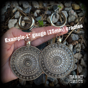 These big beautiful antique silver mandala gauged earrings are gorgeous!! Weighing in at approx 33grams a piece, measuring just on 12cms from tip to tip, this pair of gauged earrings are lovely and dangly but not too heavy.

This pair have been made on 1” gauge (25mm) surgical steel cradles, suitable for stretched lobes.
