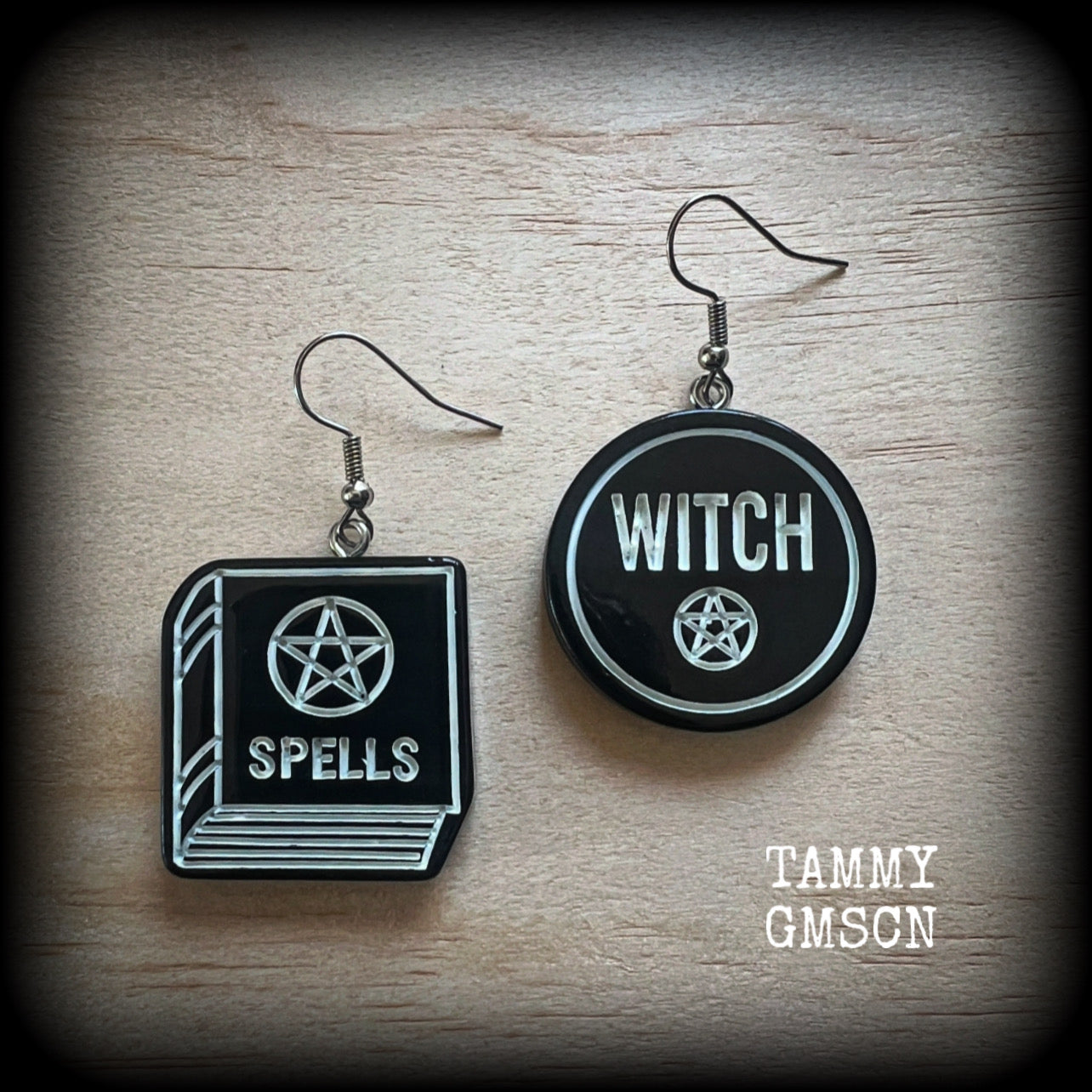 These awesome earrings feature light weight black and white witchy spell book and witchy pentagram charms, are super lightweight at only a few grams each, and are nice and dangly, measuring approx 5cms from tip to tip.

This pair has made on stainless steel french hooks, suitable for pierced ears or stretched lobes.

