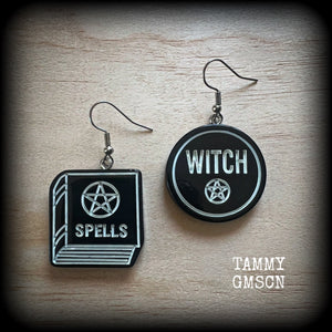 These awesome earrings feature light weight black and white witchy spell book and witchy pentagram charms, are super lightweight at only a few grams each, and are nice and dangly, measuring approx 5cms from tip to tip.

This pair has made on stainless steel french hooks, suitable for pierced ears or stretched lobes.

