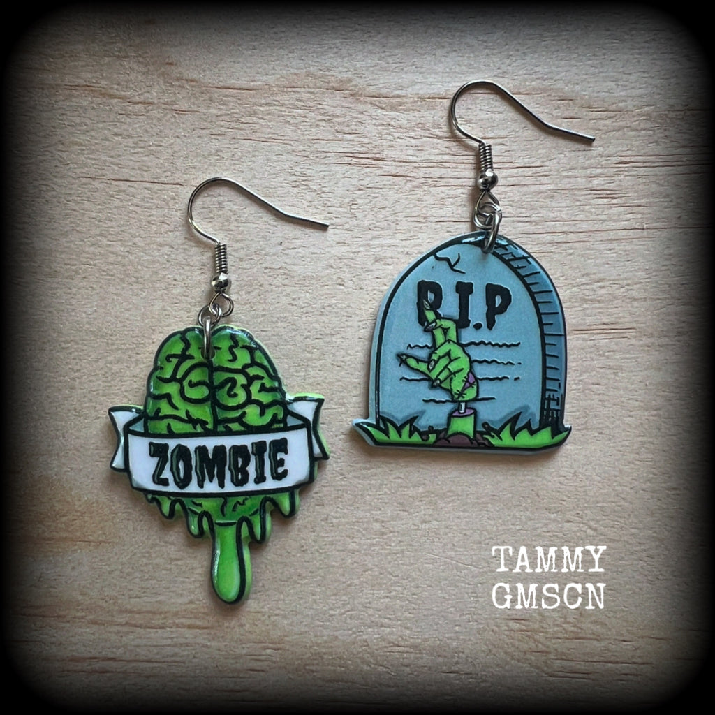 These awesome zombie movie inspired earrings feature light weight green and grey acrylic zombie brains and tombstone charms, are super lightweight at only a few grams each, and are nice and dangly, measuring just under 6cms from tip to tip.

This pair has made on stainless steel french hooks, suitable for pierced ears or stretched lobes.
