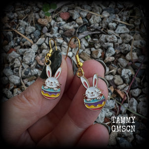 Super cute and super light weight, these adorable earrings feature colourful enamel and antique gold bunny rabbit and easter egg charms.

Measuring just under 4cms from tip to tip and weighing only a gram or two each, this pair has been made with french hooks-for pierced ears.