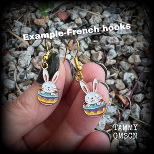 Super cute and super light weight, these adorable earrings feature colourful enamel and antique gold bunny rabbit and easter egg charms.

Measuring just under 4cms from tip to tip and weighing only a gram or two each, this pair has been made with french hooks-for pierced ears.
