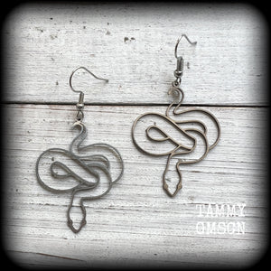 These earrings feature a gorgeous coiled stainless steel snake, measuring 6cms from tip to tip, and super lightweight at only a few grams each.

This pair have been made with stainless steel french hooks, suitable for pierced ears.