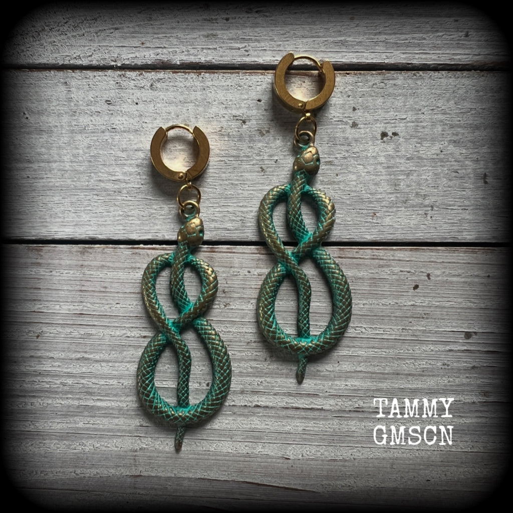 These awesome earrings feature antique bronze snake twisted into an infinity symbol, weighing in at 8 grams each, and measuring approx 7.5cms from tip to tip.

This pair have been made on stainless steel huggie ear cuffs, suitable for pierced ears.