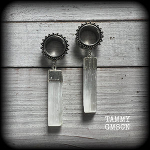 These unique earrings have been made with beautiful rustic Selenite pieces, weighing approx 15grams each and measure just over 7cms from tip to tip.

This pair has been made with 5/8" (16mm) gauge ornate surgical steel screw fit tunnels.