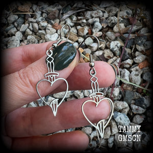 This pair of earrings feature a classic punk stainless steel heart and dagger, measuring just over 5cms from tip to tip, these earrings are lovely and lightweight, weighing only a grams or two each.  This pair has been made on stainless steel french hooks, suitable for pierced ears.
