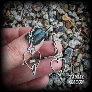 This pair of earrings feature a classic punk stainless steel heart and dagger, measuring just over 5cms from tip to tip, these earrings are lovely and lightweight, weighing only a grams or two each.  This pair has been made on stainless steel french hooks, suitable for pierced ears.