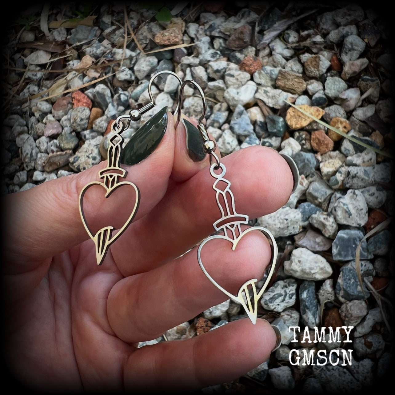 This pair of earrings feature a classic punk stainless steel heart and dagger, measuring just over 5cms from tip to tip, these earrings are lovely and lightweight, weighing only a grams or two each.  This pair has been made on stainless steel french hooks, suitable for pierced ears.