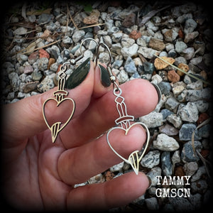 This pair of earrings feature a classic punk stainless steel heart and dagger, measuring just over 5cms from tip to tip, these earrings are lovely and lightweight, weighing only a grams or two each.  This pair has been made on stainless steel french hooks, suitable for pierced ears.