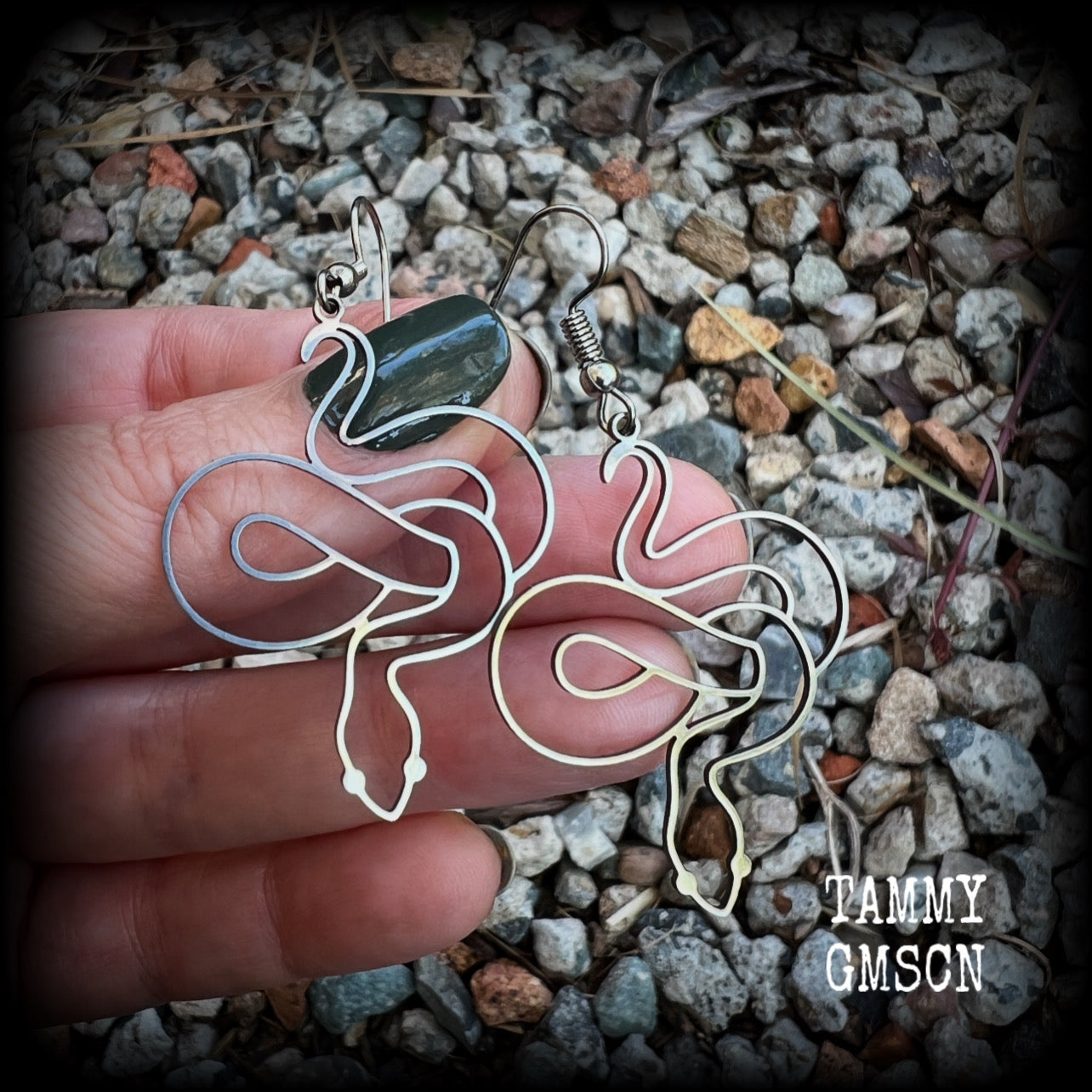 These earrings feature a gorgeous coiled stainless steel snake, measuring 6cms from tip to tip, and super lightweight at only a few grams each.  This pair have been made with stainless steel french hooks, suitable for pierced ears.