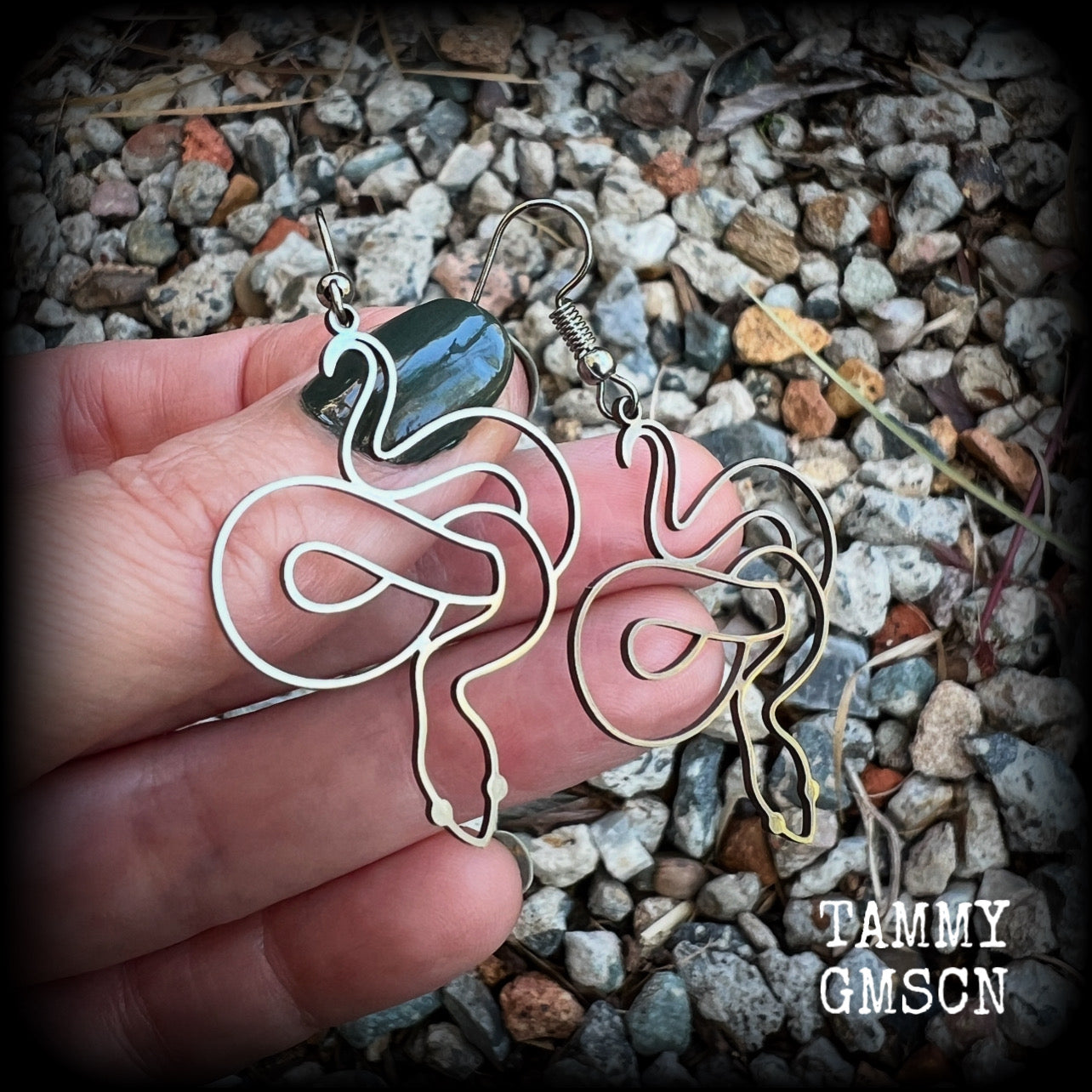 These earrings feature a gorgeous coiled stainless steel snake, measuring 6cms from tip to tip, and super lightweight at only a few grams each.  This pair have been made with stainless steel french hooks, suitable for pierced ears.