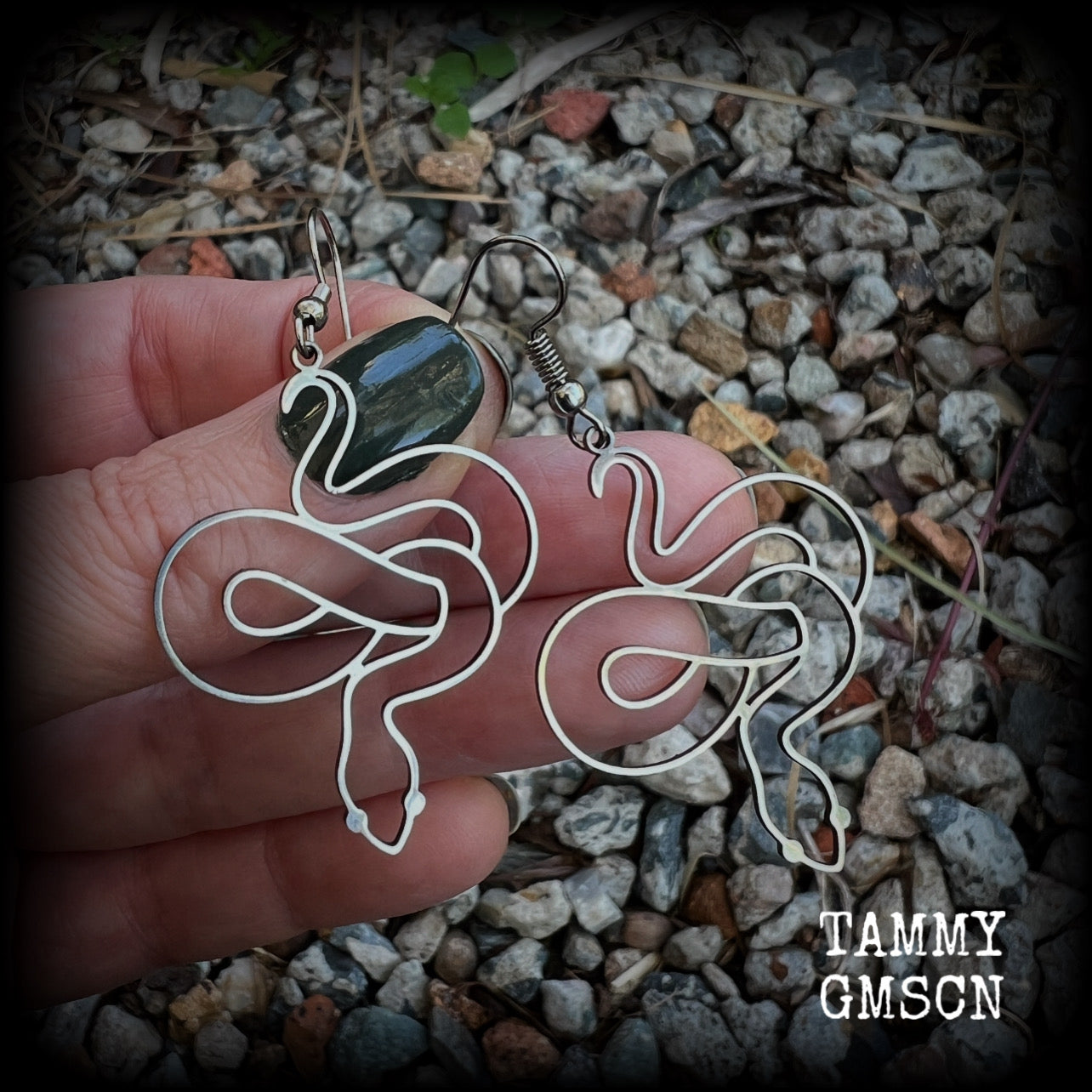These earrings feature a gorgeous coiled stainless steel snake, measuring 6cms from tip to tip, and super lightweight at only a few grams each.  This pair have been made with stainless steel french hooks, suitable for pierced ears.