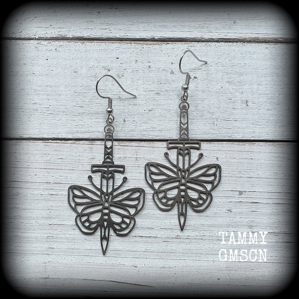 This pair of stainless steel earrings features a classic punk butterfly and dagger tattoo design, measuring just on 7cms from tip to tip, and weighing only a grams or two each.

This pair has been made on stainless steel french hooks, suitable for pierced ears.