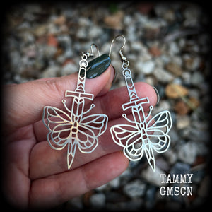 This pair of stainless steel earrings features a classic punk butterfly and dagger tattoo design, measuring just on 7cms from tip to tip, and weighing only a grams or two each.

This pair has been made on stainless steel french hooks, suitable for pierced ears.