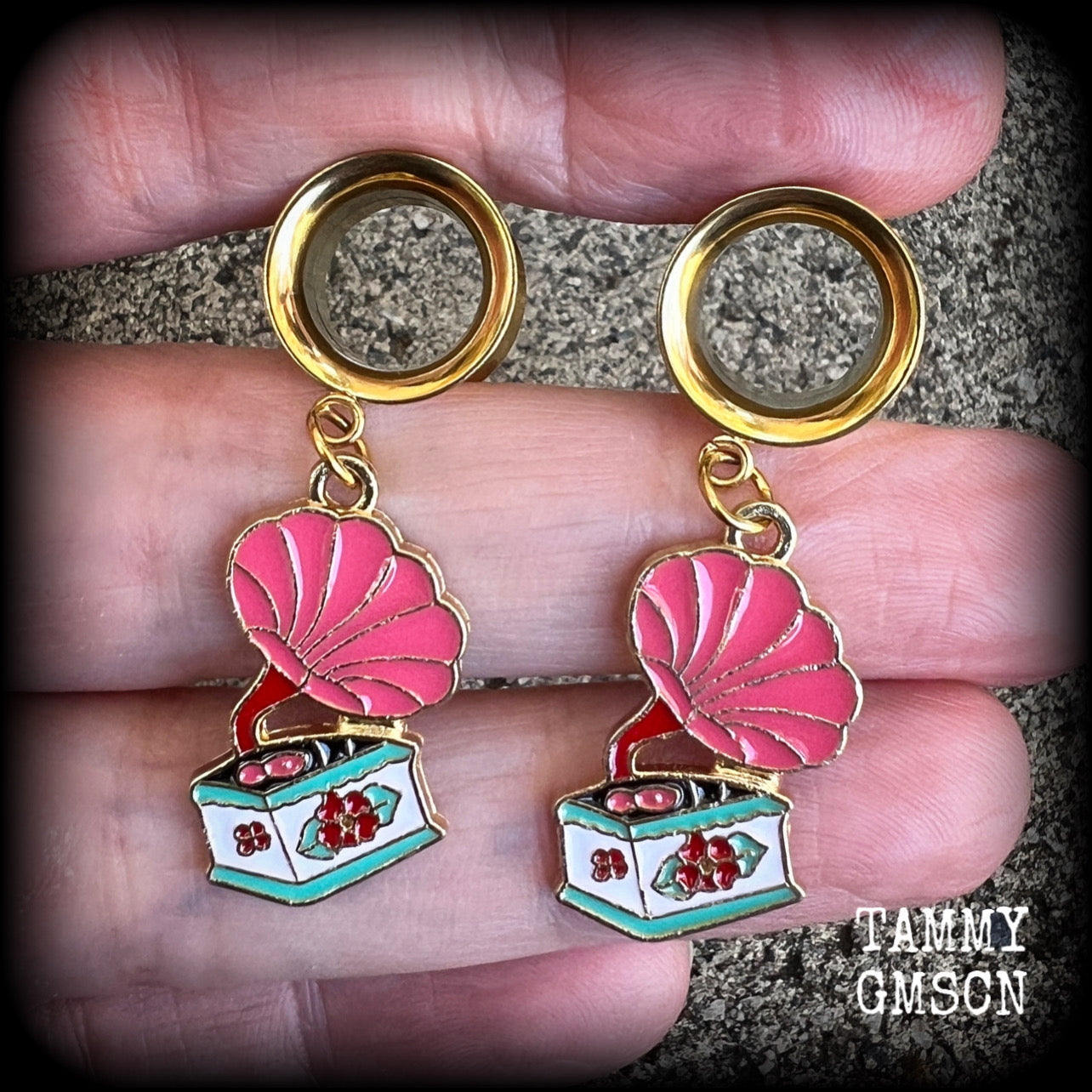 These cute little earrings have been made with pink and gold enamel gramophone charms, weighing only 5 grams each and measuring approx 4cms from tip to tip.

This pair has been made with 1/2" gauge (12mm) surgical steel screw fit earlets, for stretched lobes.