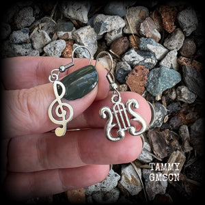 This awesome pair of earrings features antique silver treble clef with a vintage lyre music stand charm, are nice and lightweight weighing only a few grams each, and measure approx 4cms from tip to tip.

This pair has been made on stainless steel french hooks, suitable for pierced ears.
