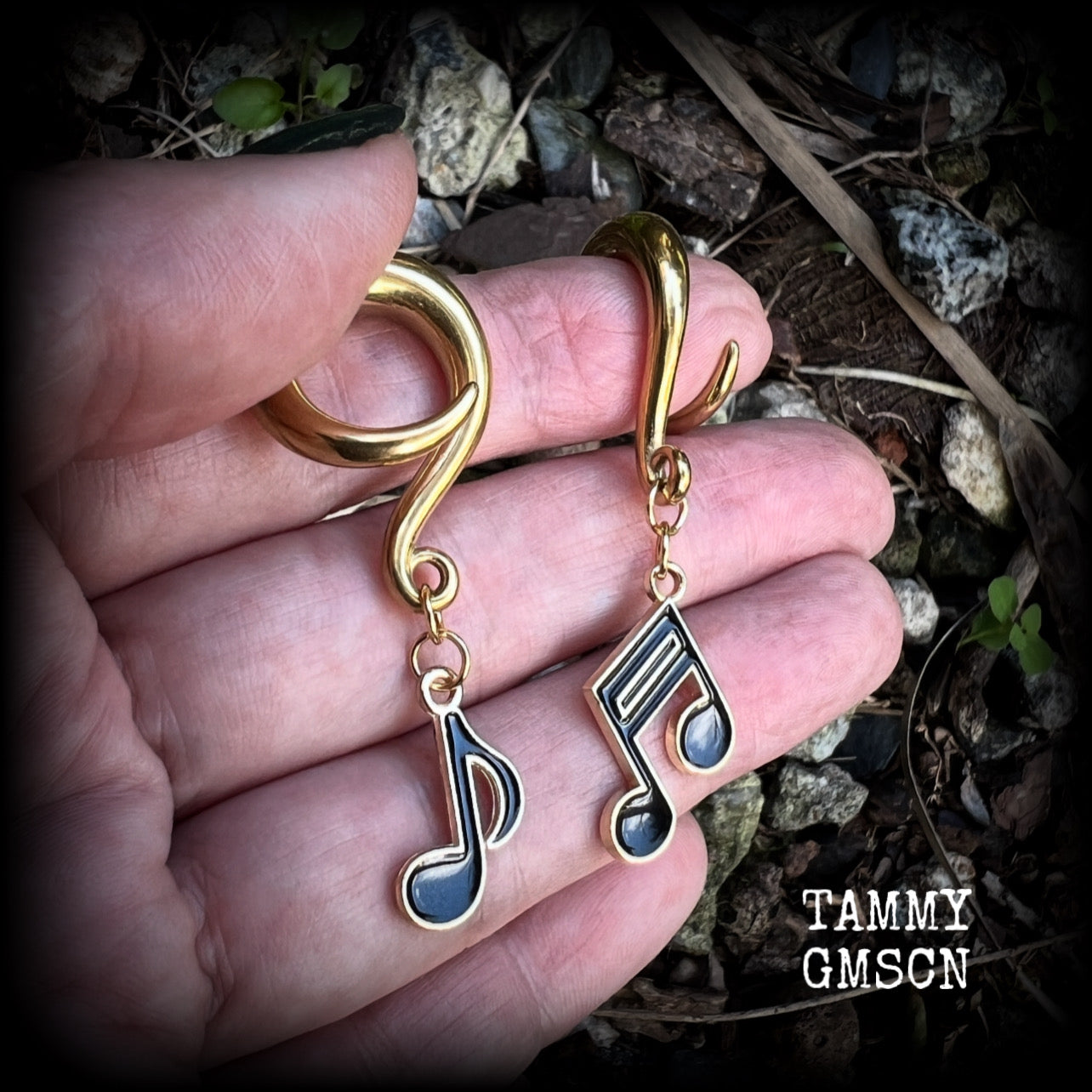 These awesome gauged earrings feature gorgeous antique gold and black enamel music notes, not too heavy at approx 8 grams a piece, and nice and dangly at just on 6cms from tip to tip.

This pair has been made on 2 gauge (6mm) surgical steel full curl hooks, suitable for stretched lobes.