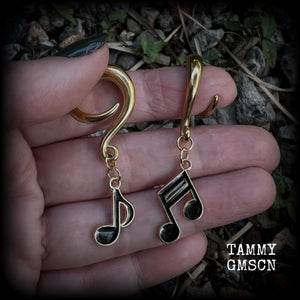 These awesome gauged earrings feature gorgeous antique gold and black enamel music notes, not too heavy at approx 8 grams a piece, and nice and dangly at just on 6cms from tip to tip.

This pair has been made on 2 gauge (6mm) surgical steel full curl hooks, suitable for stretched lobes.