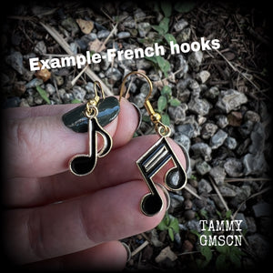 This awesome little pair of earrings features black enamel and antique gold music notes, are nice and lightweight weighing only a few grams each, and measure approx 4cms from tip to tip. This pair has been made on antique gold french hooks.