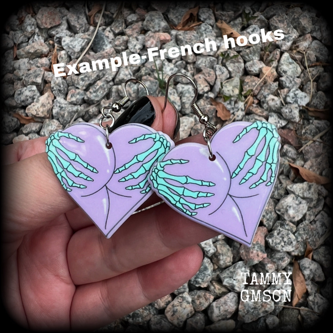 These cheeky pastel goth halloween earrings feature light weight skeleton hands grabbing a pair of purple butt cheeks, super lightweight at only a few grams each, and nice and dangly at 6cms from tip to tip.  This pair has made on stainless steel french hooks, suitable for pierced ears.