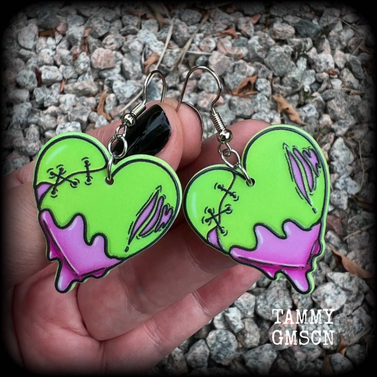 These awesome 'Zombie heart' earrings feature light weight purple and green acrylic rotting zombie hearts, are super lightweight at only 3 grams each, and are nice and dangly, measuring just under 6cms from tip to tip.  This pair has made on stainless steel french hooks, suitable for pierced ears or stretched lobes.