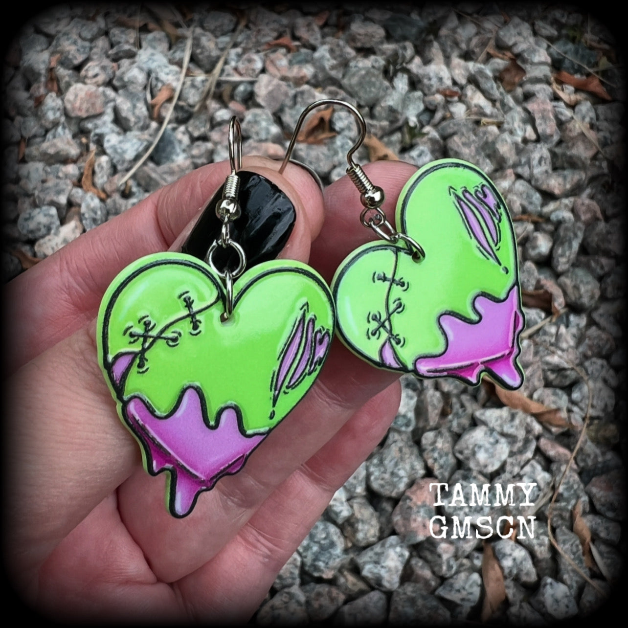 These awesome 'Zombie heart' earrings feature light weight purple and green acrylic rotting zombie hearts, are super lightweight at only 3 grams each, and are nice and dangly, measuring just under 6cms from tip to tip.  This pair has made on stainless steel french hooks, suitable for pierced ears or stretched lobes.