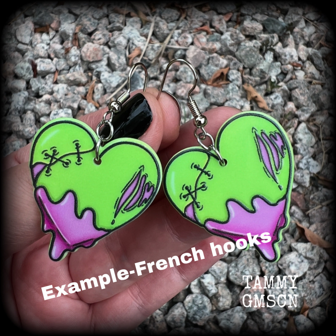 These awesome 'Zombie heart' earrings feature light weight purple and green acrylic rotting zombie hearts, are super lightweight at only 3 grams each, and are nice and dangly, measuring just under 6cms from tip to tip.  This pair has made on stainless steel french hooks, suitable for pierced ears or stretched lobes.