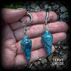Featuring gorgeous one of a kind blue lace agate pendulums, these earrings weigh in at approx 11 grams a piece, and are nice and dangly at just on 7cms from tip to tip.  This pair has been made on 6 gauge (4mm) surgical steel full curl hooks, to be worn in stretched lobes.
