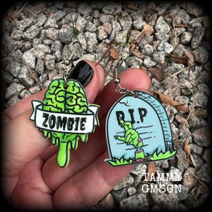 These awesome zombie movie inspired earrings feature light weight green and grey acrylic zombie brains and tombstone charms, are super lightweight at only a few grams each, and are nice and dangly, measuring just under 6cms from tip to tip.  This pair has made on stainless steel french hooks, suitable for pierced ears or stretched lobes.