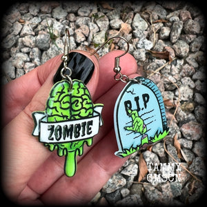 These awesome zombie movie inspired earrings feature light weight green and grey acrylic zombie brains and tombstone charms, are super lightweight at only a few grams each, and are nice and dangly, measuring just under 6cms from tip to tip.  This pair has made on stainless steel french hooks, suitable for pierced ears or stretched lobes.