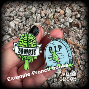These awesome zombie movie inspired earrings feature light weight green and grey acrylic zombie brains and tombstone charms, are super lightweight at only a few grams each, and are nice and dangly, measuring just under 6cms from tip to tip.  This pair has made on stainless steel french hooks, suitable for pierced ears or stretched lobes.