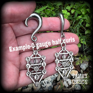 Our 'Tree of Life' gauged earrings feature stunning Kabalistic Tree of Life charms complete with sephiroth symbols. These earrings and are nice and dangly at just on 7cms, and weigh 8 grams a piece.
This pair has been made on 0 gauge (8mm) surgical steel half curl hooks, to be worn in stretched lobes.