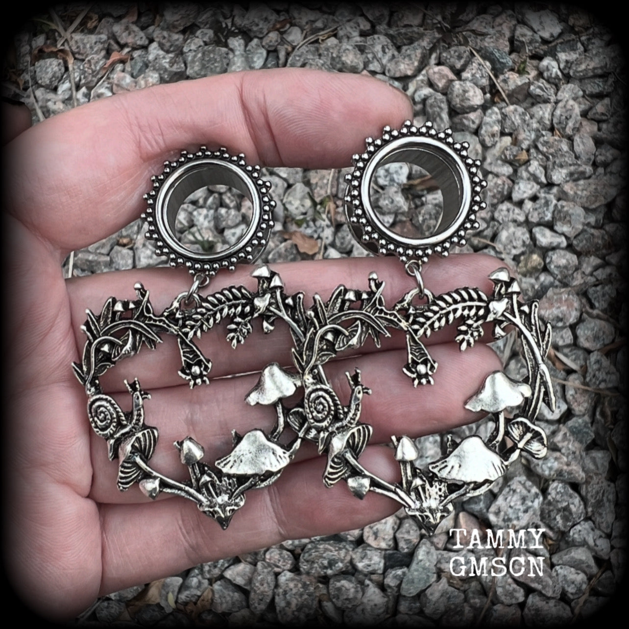 These awesome antique silver forest punk tunnel earrings are gorgeous!!  Featuring a heart of ferns with snails, mushrooms and spiders, these earrings weigh approx 14 grams each, and measure in at 6.5 cms from tip to tip.  This pair have been made with 5/8” gauge (16mm) surgical steel screw fit ornate tunnels.