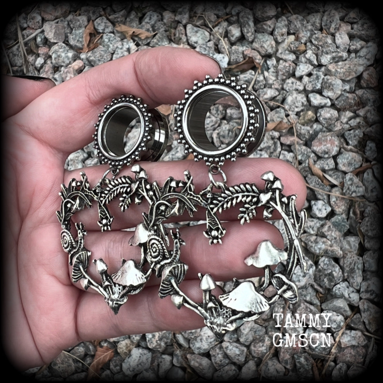 These awesome antique silver forest punk tunnel earrings are gorgeous!!  Featuring a heart of ferns with snails, mushrooms and spiders, these earrings weigh approx 14 grams each, and measure in at 6.5 cms from tip to tip.  This pair have been made with 5/8” gauge (16mm) surgical steel screw fit ornate tunnels.