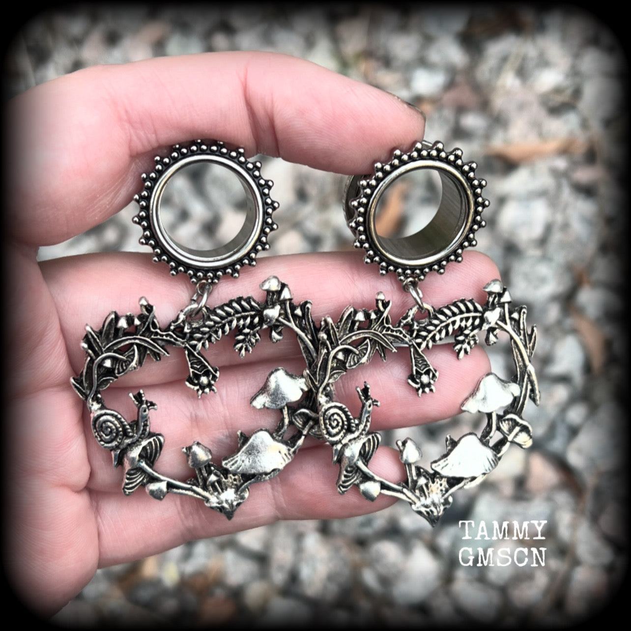 These awesome antique silver forest punk tunnel earrings are gorgeous!!  Featuring a heart of ferns with snails, mushrooms and spiders, these earrings weigh approx 14 grams each, and measure in at 6.5 cms from tip to tip.  This pair have been made with 5/8” gauge (16mm) surgical steel screw fit ornate tunnels.