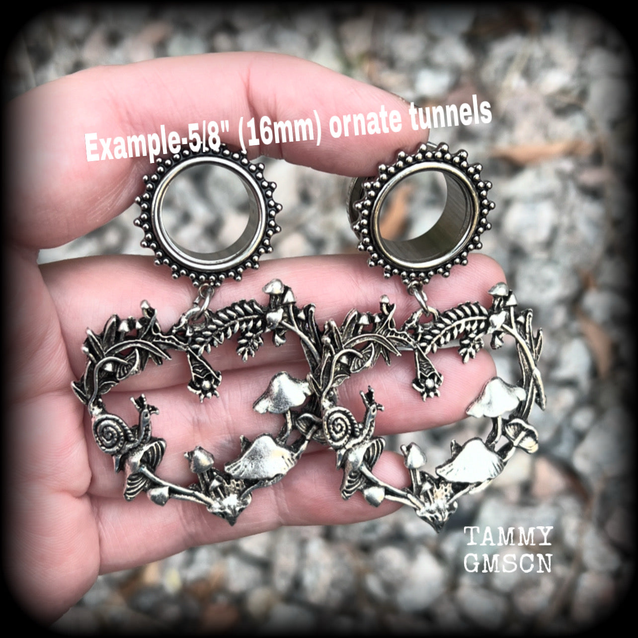 These awesome antique silver forest punk tunnel earrings are gorgeous!!  Featuring a heart of ferns with snails, mushrooms and spiders, these earrings weigh approx 14 grams each, and measure in at 6.5 cms from tip to tip.  This pair have been made with 5/8” gauge (16mm) surgical steel screw fit ornate tunnels.