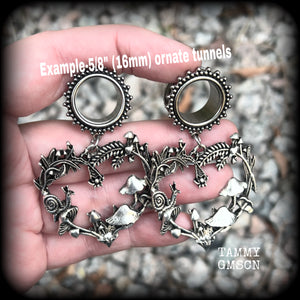 These awesome antique silver forest punk tunnel earrings are gorgeous!!  Featuring a heart of ferns with snails, mushrooms and spiders, these earrings weigh approx 14 grams each, and measure in at 6.5 cms from tip to tip.  This pair have been made with 5/8” gauge (16mm) surgical steel screw fit ornate tunnels.