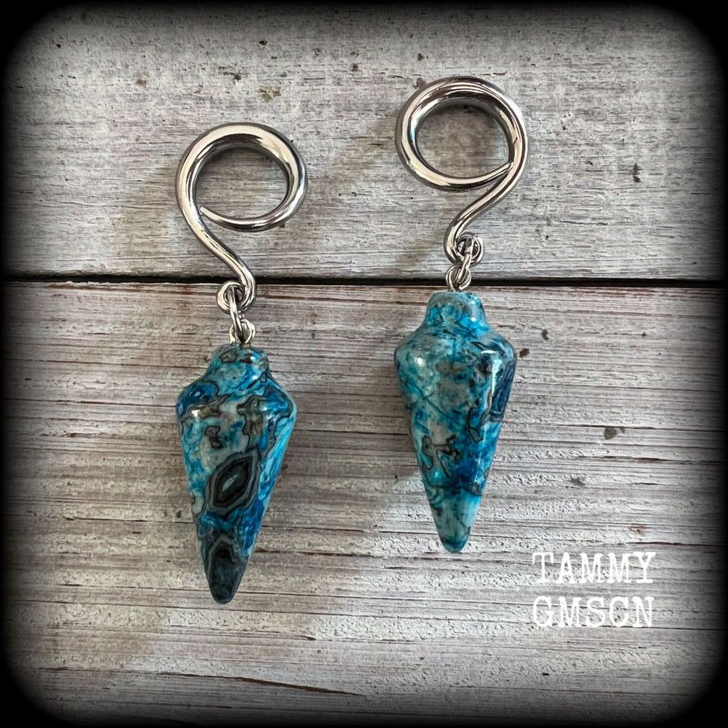 Featuring gorgeous one of a kind blue lace agate pendulums, these earrings weigh in at approx 11 grams a piece, and are nice and dangly at just on 7cms from tip to tip.

This pair has been made on 6 gauge (4mm) surgical steel full curl hooks, to be worn in stretched lobes.