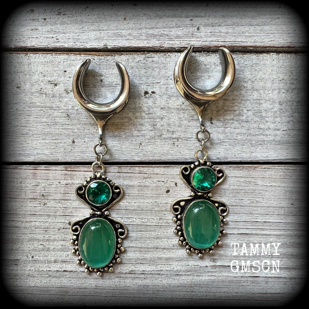 This pair of earrings features gorgeous green topaz and cats eye gemstones in a beautiful boho antique silver setting, weighing approx 10 grams a piece and measuring just over 7cms from tip to tip.

This pair have been made on 5/8” gauge (16mm) surgical steel cradles, to be worn in stretched lobes.