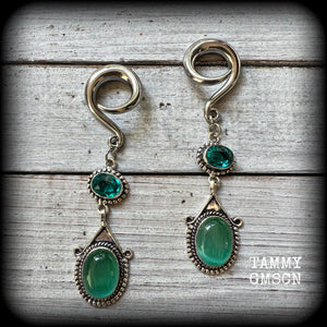 This pair of earrings features gorgeous green topaz and cats eye gemstones in a beautiful boho antique silver setting, weighing approx 14 grams a piece and measuring just on 8.5cms from tip to tip.

This pair have been made on 2 gauge (6mm) surgical steel full curls, to be worn in stretched lobes.