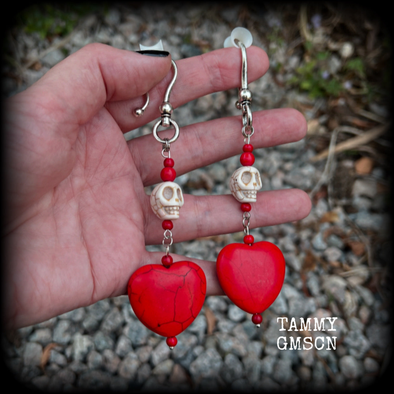 This pair of beautiful earrings features gorgeous big blood red stone hearts with bone white howlite stone skulls, measuring just under 12cm from tip to tip and weighing 18 grams each, these are nice and dangly.  This pair have been made with large antique silver shephard hooks, suitable for stretched lobes when worn with silicone earlets from 2 gauge (6mm).