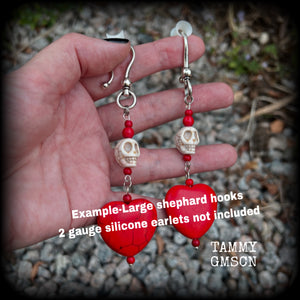 This pair of beautiful earrings features gorgeous big blood red stone hearts with bone white howlite stone skulls, measuring just under 12cm from tip to tip and weighing 18 grams each, these are nice and dangly.  This pair have been made with large antique silver shephard hooks, suitable for stretched lobes when worn with silicone earlets from 2 gauge (6mm).