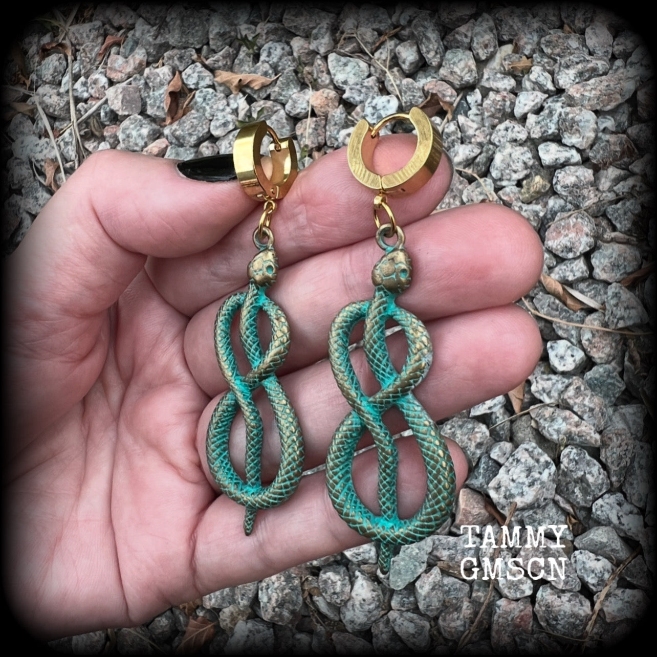 These awesome earrings feature antique bronze snake twisted into an infinity symbol, weighing in at 8 grams each, and measuring approx 7.5cms from tip to tip.  This pair have been made on stainless steel huggie ear cuffs, suitable for pierced ears.