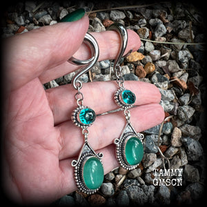 This pair of earrings features gorgeous green topaz and cats eye gemstones in a beautiful boho antique silver setting, weighing approx 14 grams a piece and measuring just on 8.5cms from tip to tip.  This pair have been made on 2 gauge (6mm) surgical steel full curls, to be worn in stretched lobes.