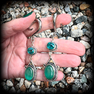 This pair of earrings features gorgeous green topaz and cats eye gemstones in a beautiful boho antique silver setting, weighing approx 14 grams a piece and measuring just on 8.5cms from tip to tip.  This pair have been made on 2 gauge (6mm) surgical steel full curls, to be worn in stretched lobes.