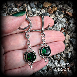 This pair of earrings features gorgeous green quartz gemstones in a beautiful antique silver setting knotwork setting, weighing approx 5 grams a piece and measuring just on 5.5cms from tip to tip.  This pair have been made on 6 gauge (4mm) surgical steel full curl hooks, to be worn in stretched lobes.