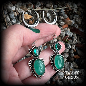 This pair of earrings features gorgeous green topaz and cats eye gemstones in a beautiful boho antique silver setting, weighing approx 10 grams a piece and measuring just over 7cms from tip to tip.  This pair have been made on 5/8” gauge (16mm) surgical steel cradles, to be worn in stretched lobes.