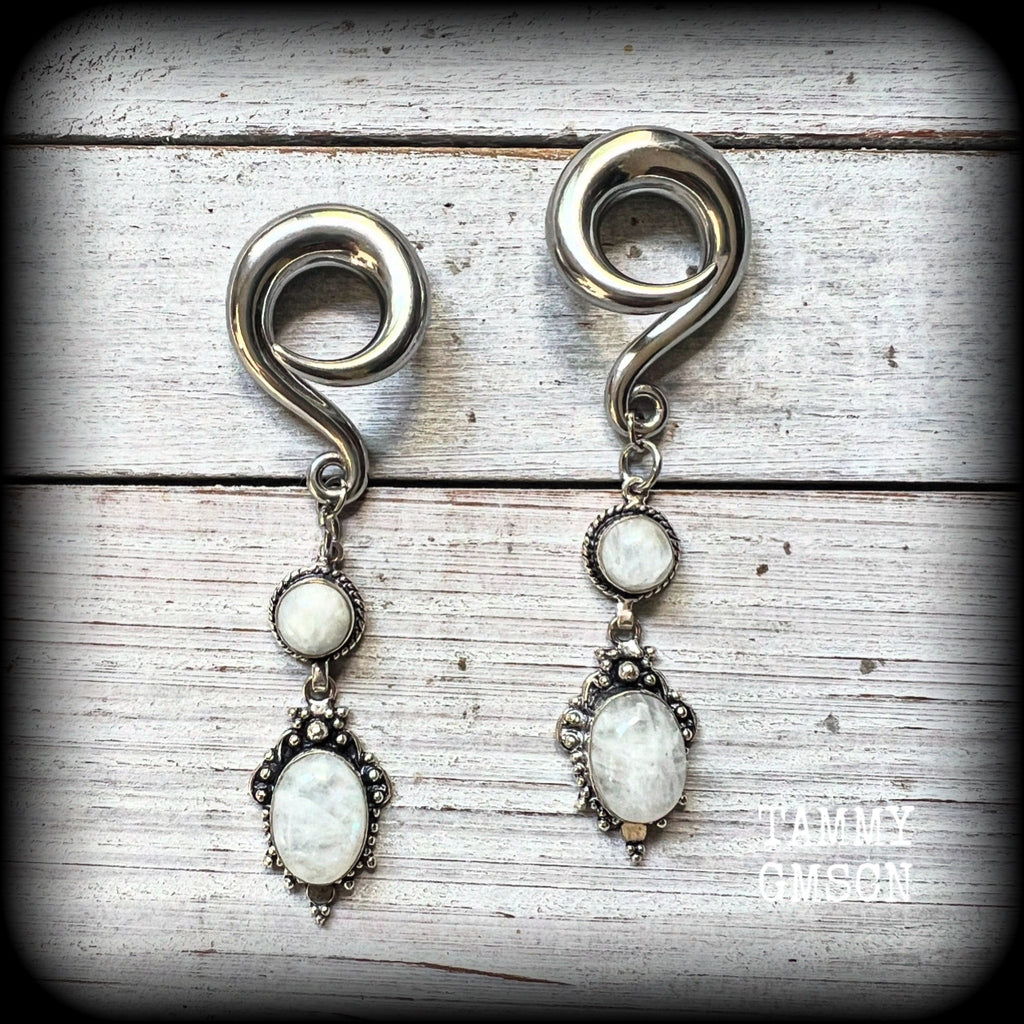 These beautiful boho Rainbow moonstone earrings are made with gorgeous polished gemstones, lovely and dangly measuring approx 8.5cms from tip to tip, and weighing approx 19 grams each.

These earrings have been made on 0 gauge (8mm) surgical steel full curl hooks, to be worn in stretched lobes.